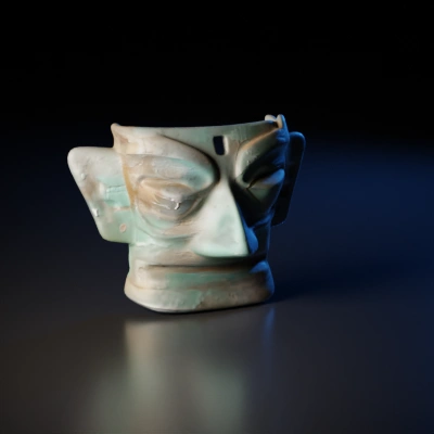 Ancient bronze ceremonial mask, large eyes.