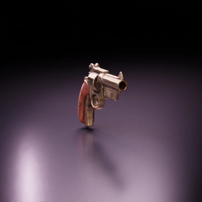 Antique revolver, ornate design, wooden grip.
