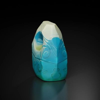 Abstract stone totem with swirling patterns.
