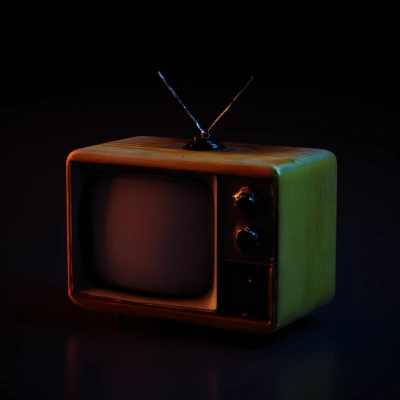 Vintage television set with antenna, classic design.