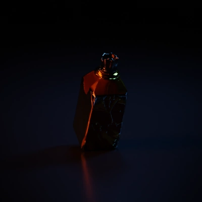 Potion bottle with wooden cork, filled with liquid.