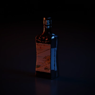 Rectangular bottle with label displaying scenic artwork.