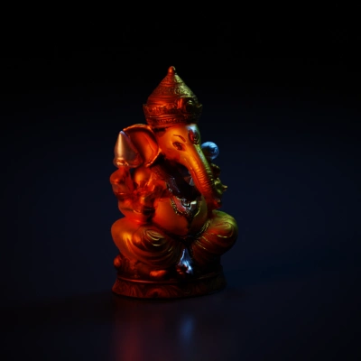 Hindu deity statue with multiple arms, elephant head.