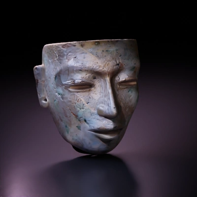 Ancient jade mask, tribal artifact.